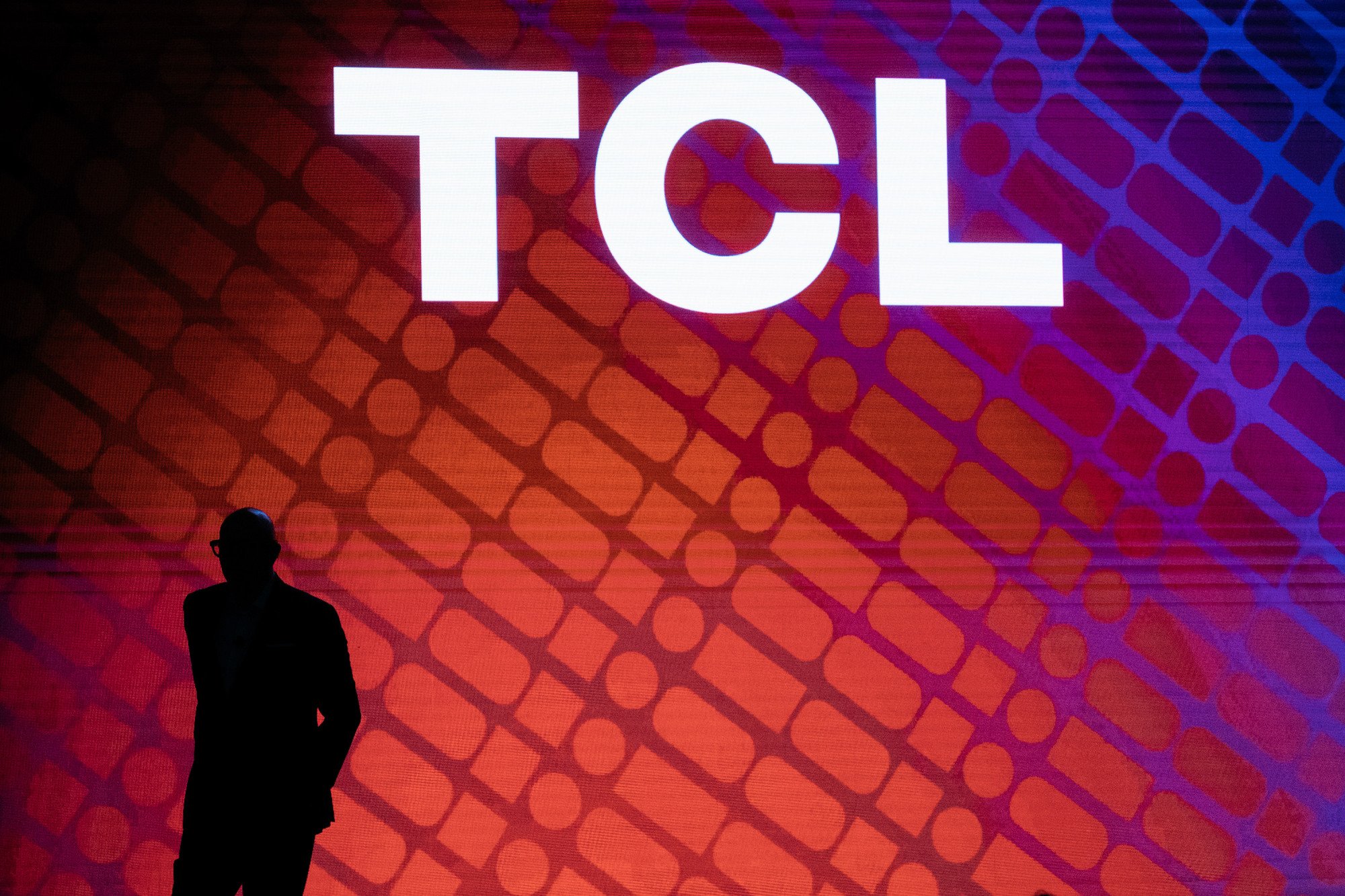 TCL logo with shadow of person