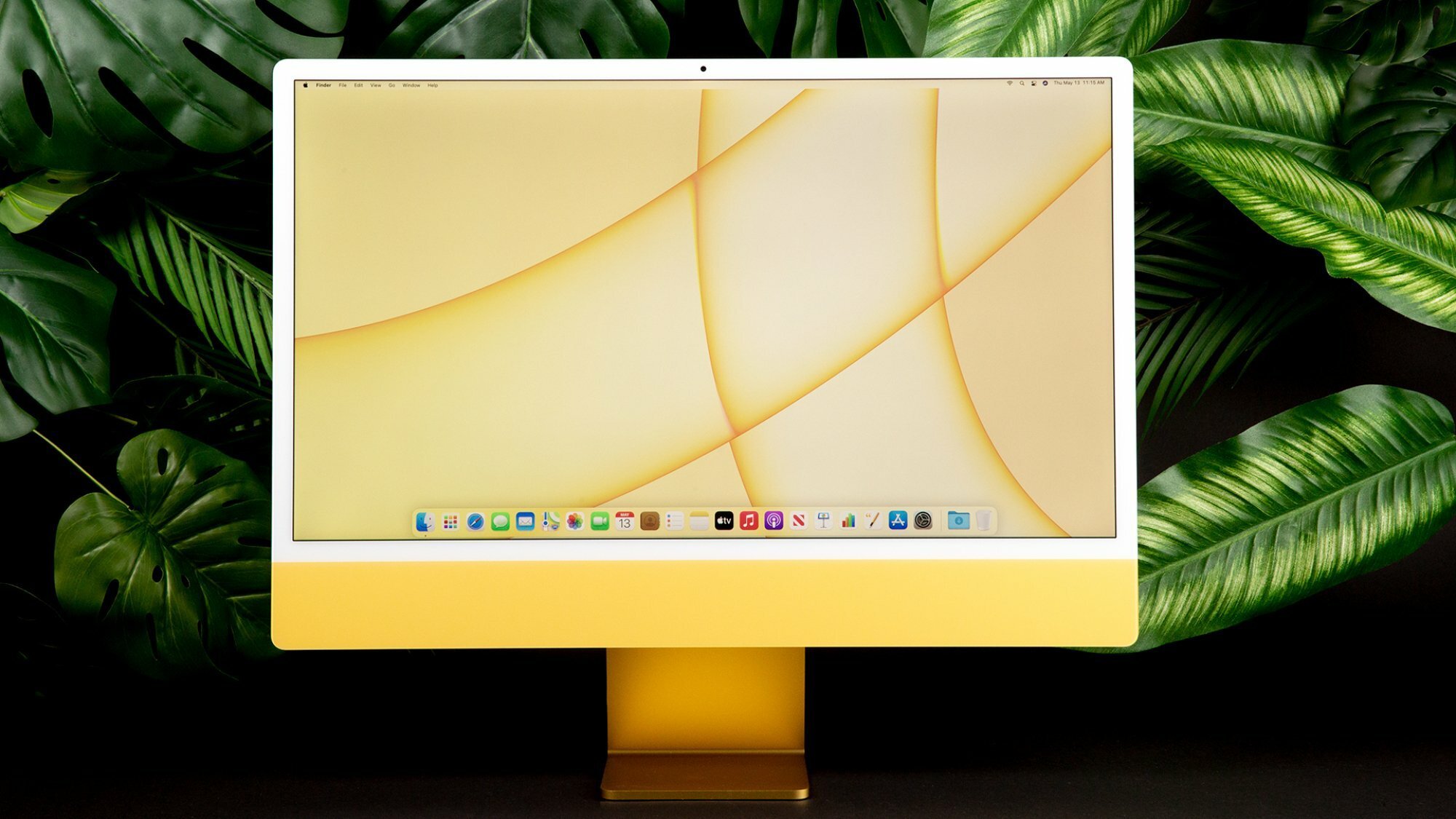 Yellow iMac on jungle background