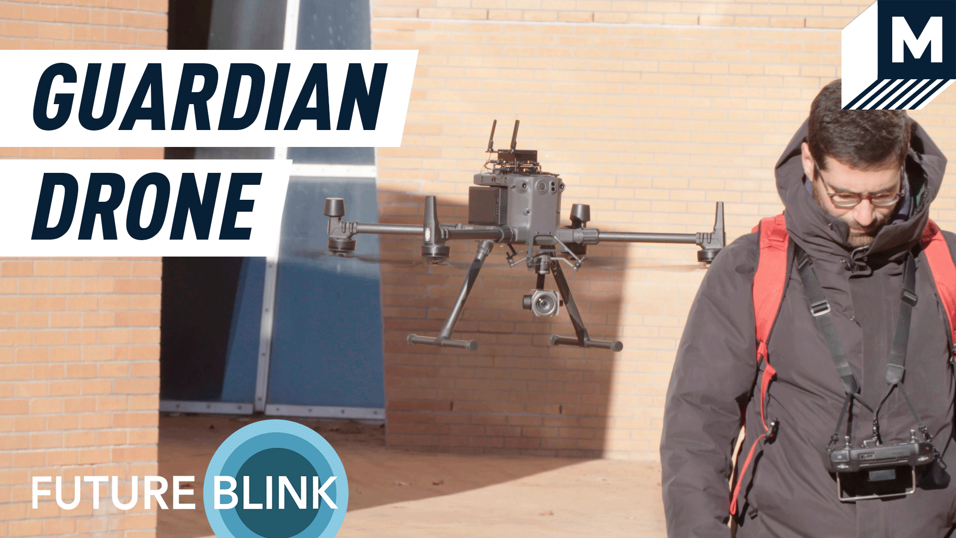 An autonomous drone following a man wearing a red backpack