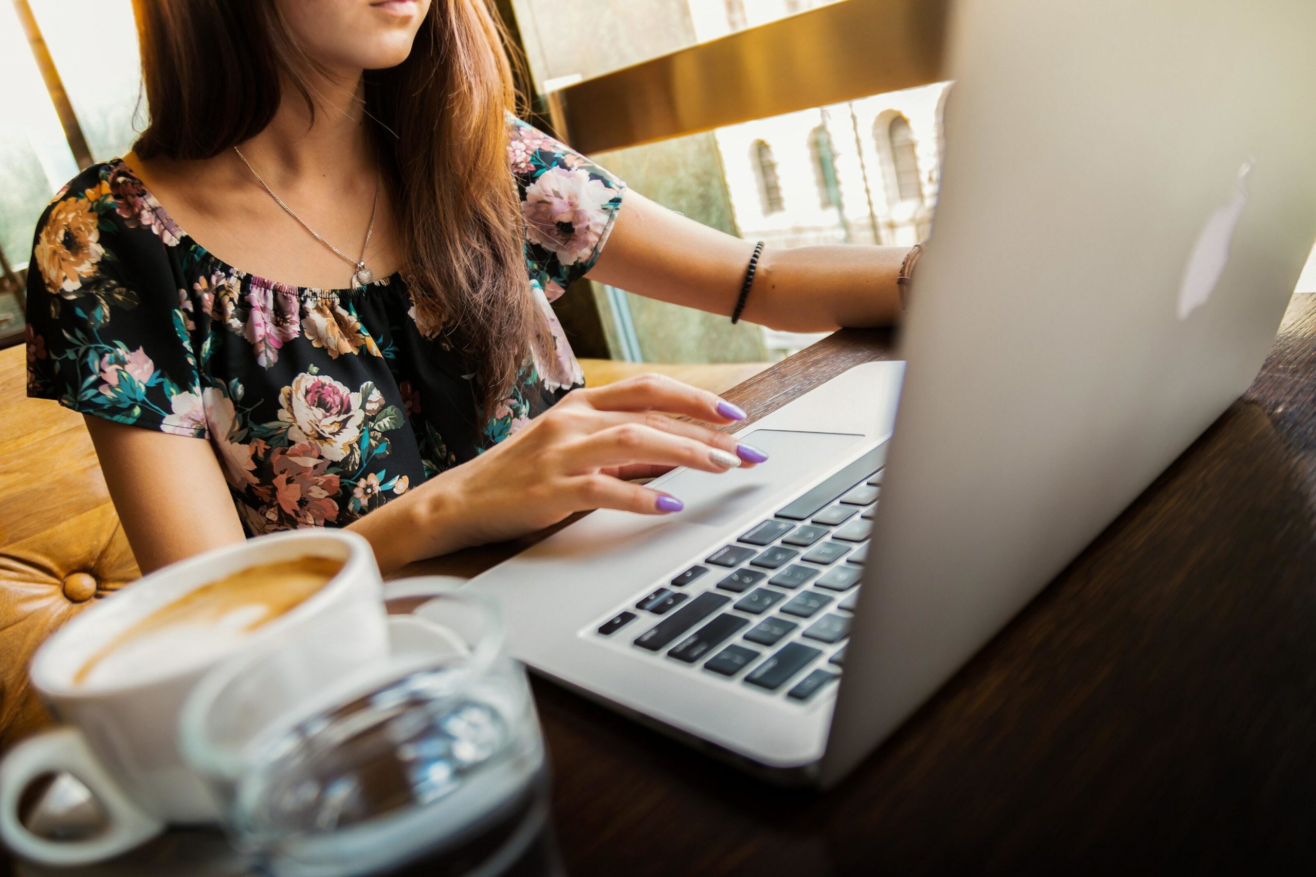 Girl with hands on laptop