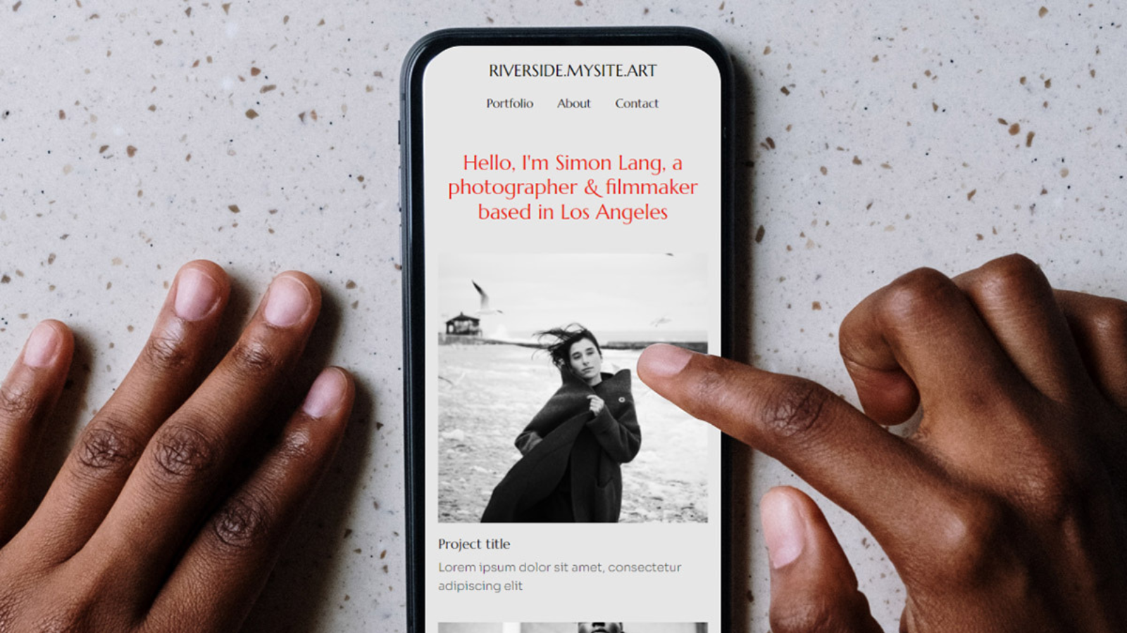 hands pointing to phone with .art domain 