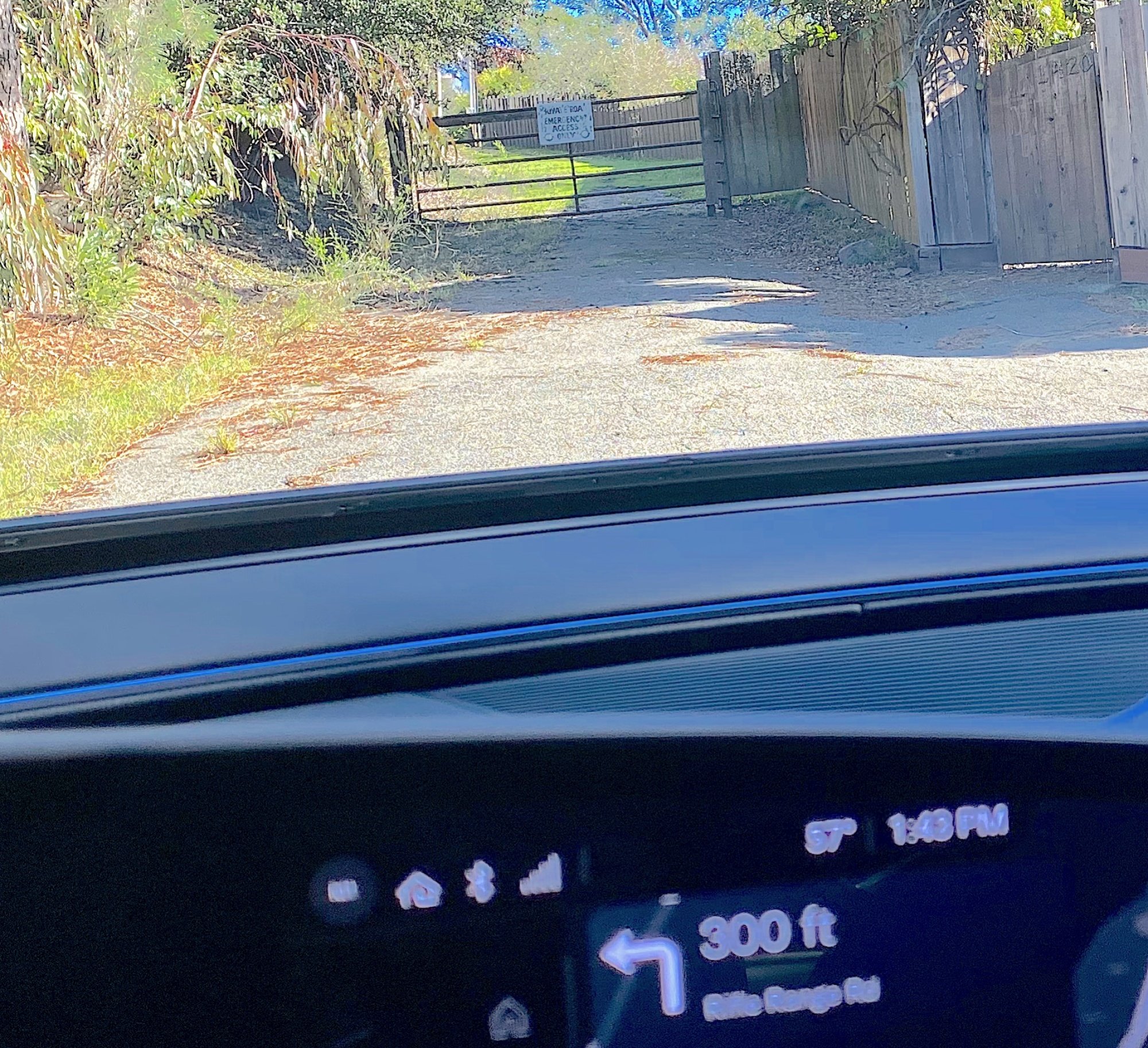 The Lucid Air Touring interior in front of a locked gate