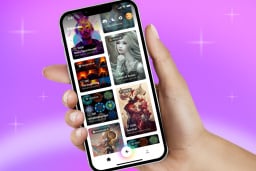 hand holding phone with wombo dream ai art tool open