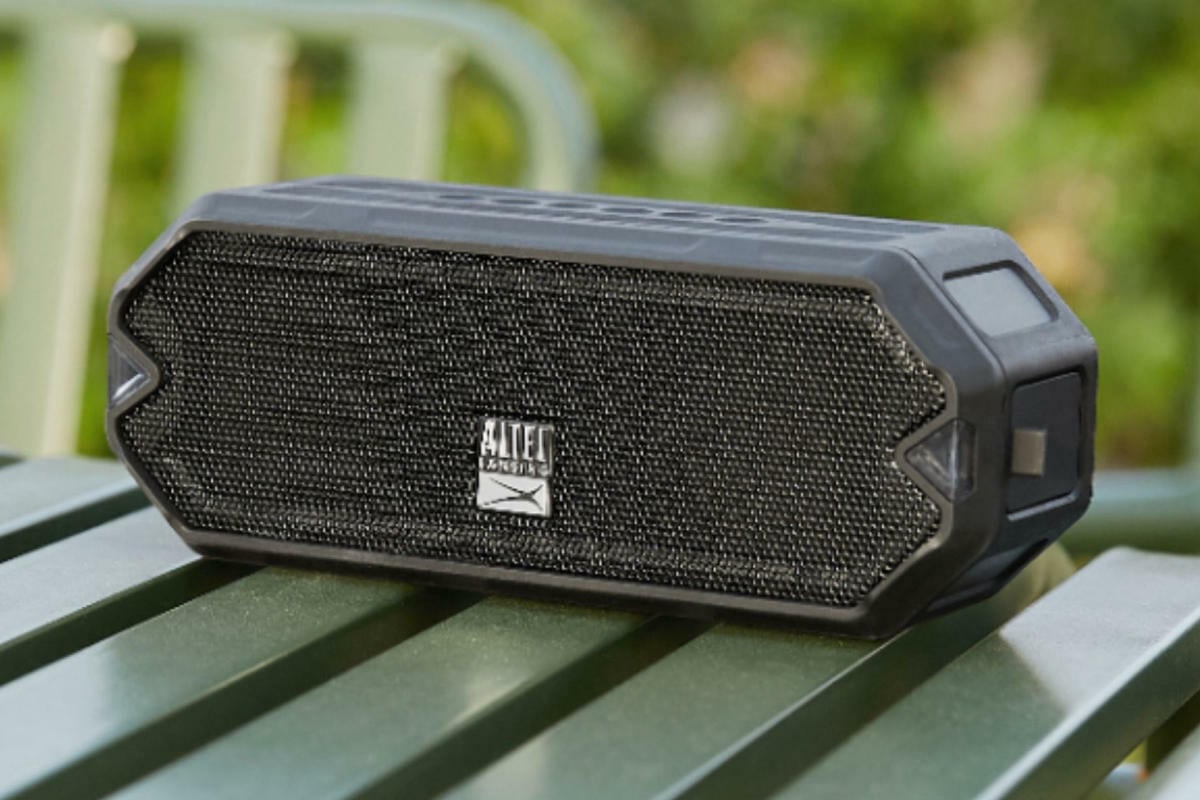 Small black speaker on a green table