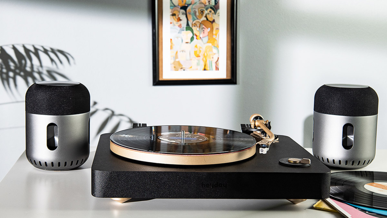 record player with kapsule 360 speakers and artwork in background