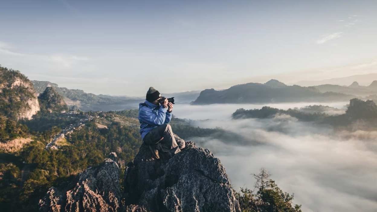 Man taking photo on mountain