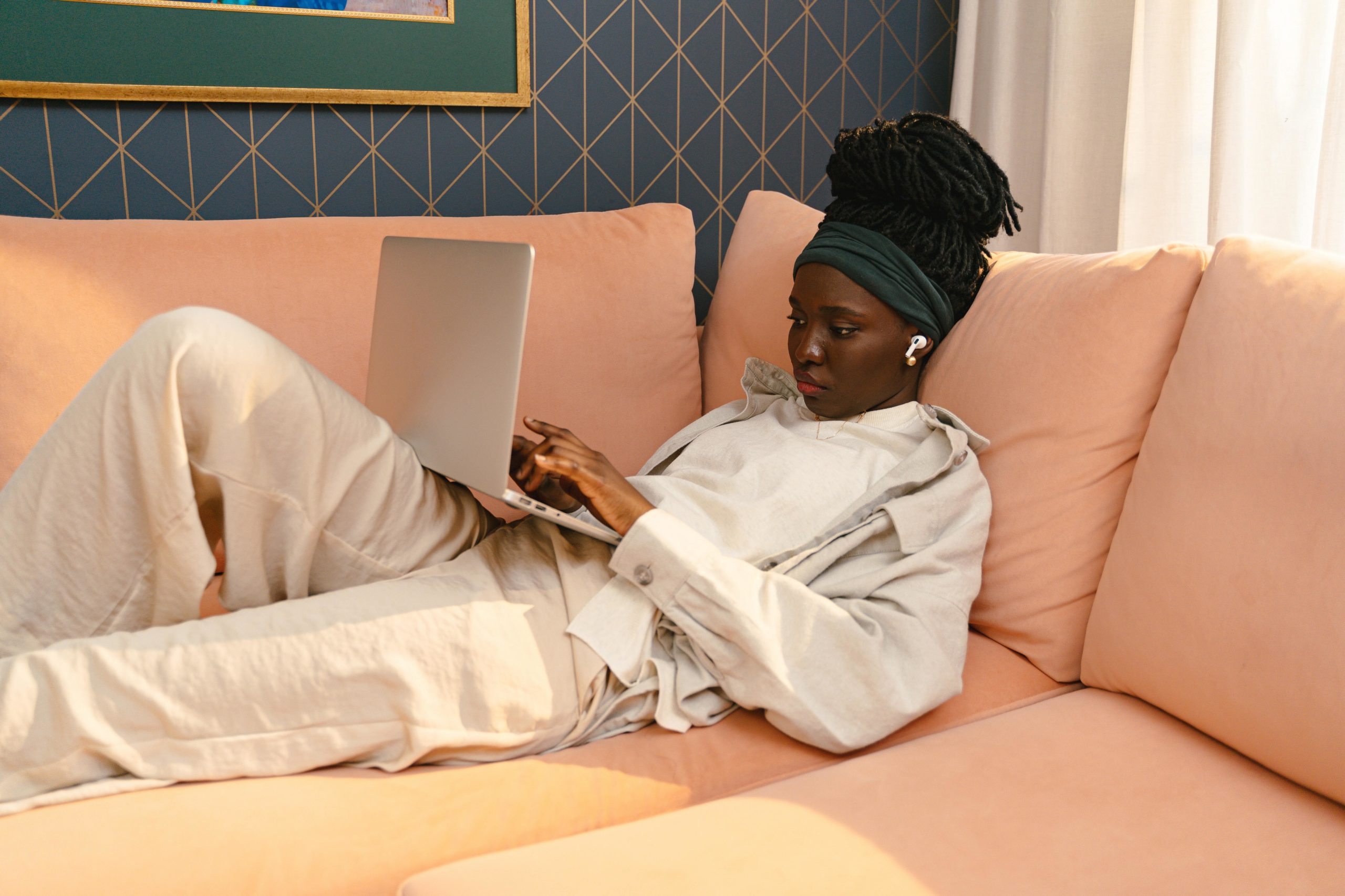 Girl looking at laptop on lap