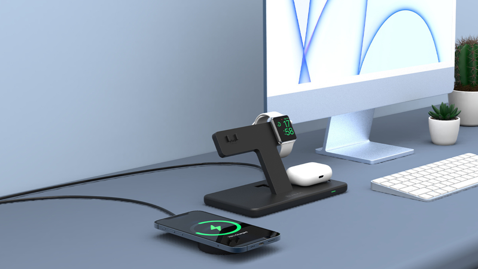 desktop with omnia charging station next to imac