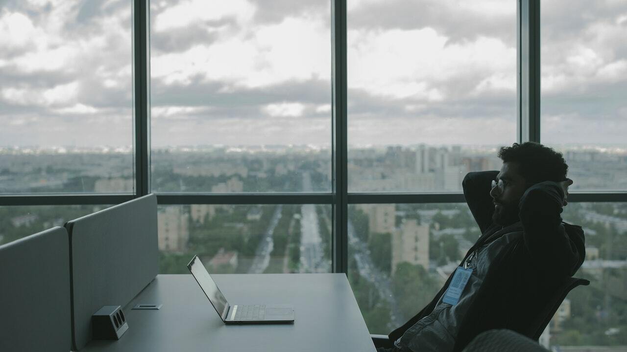 Person sitting at desk with laptop