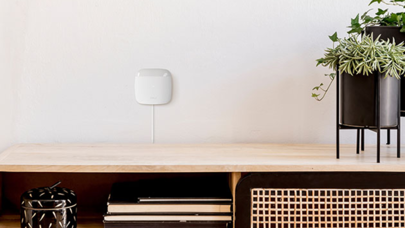 room with cielo breez lite device mounted on the wall 