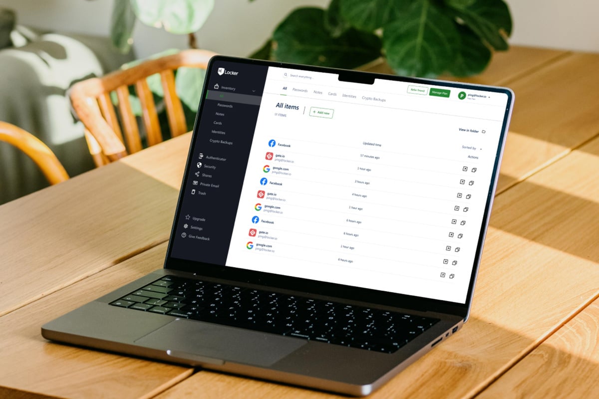 laptop is open on top of a wooden coffee table