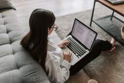 Woman editing a document on a laptop