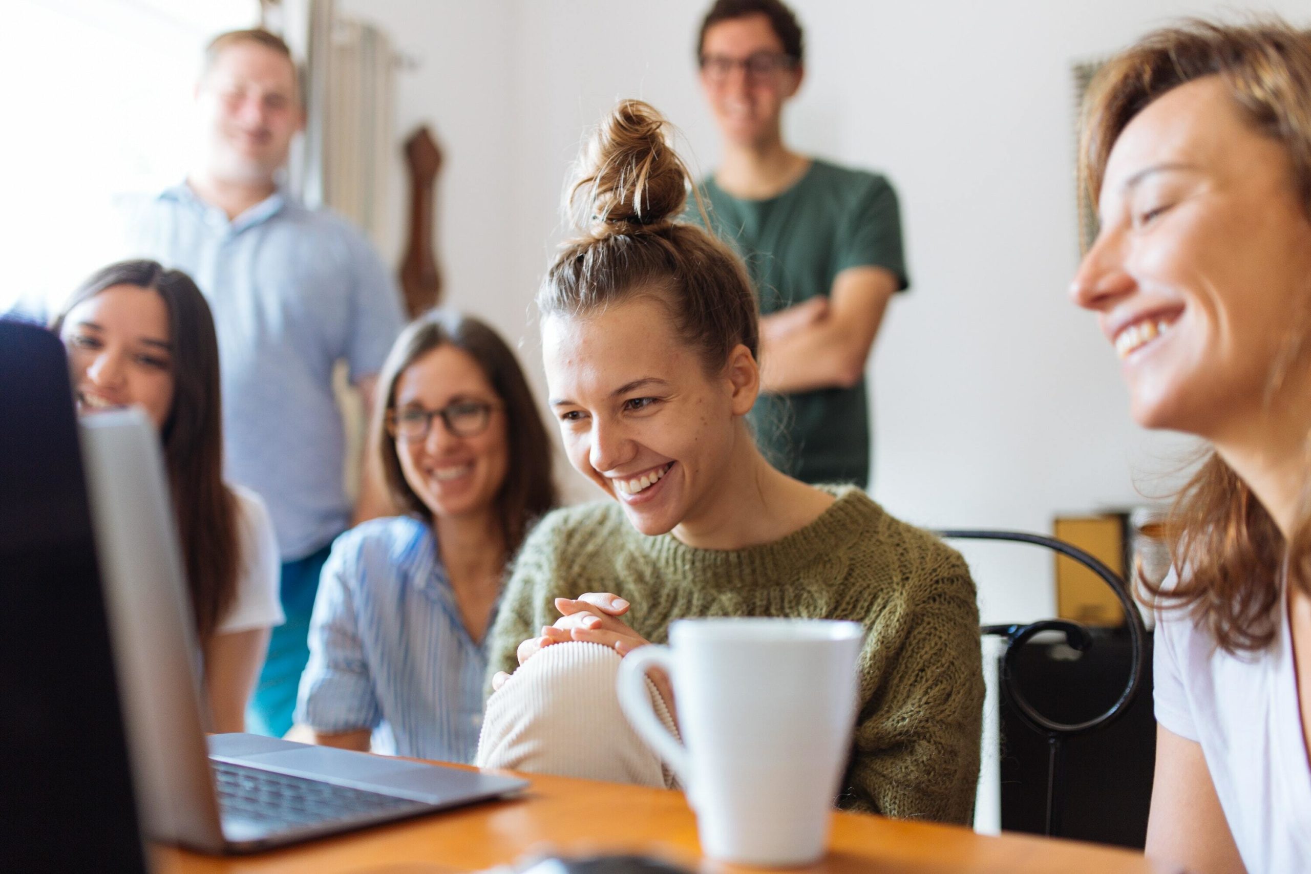 Group smiling at screen