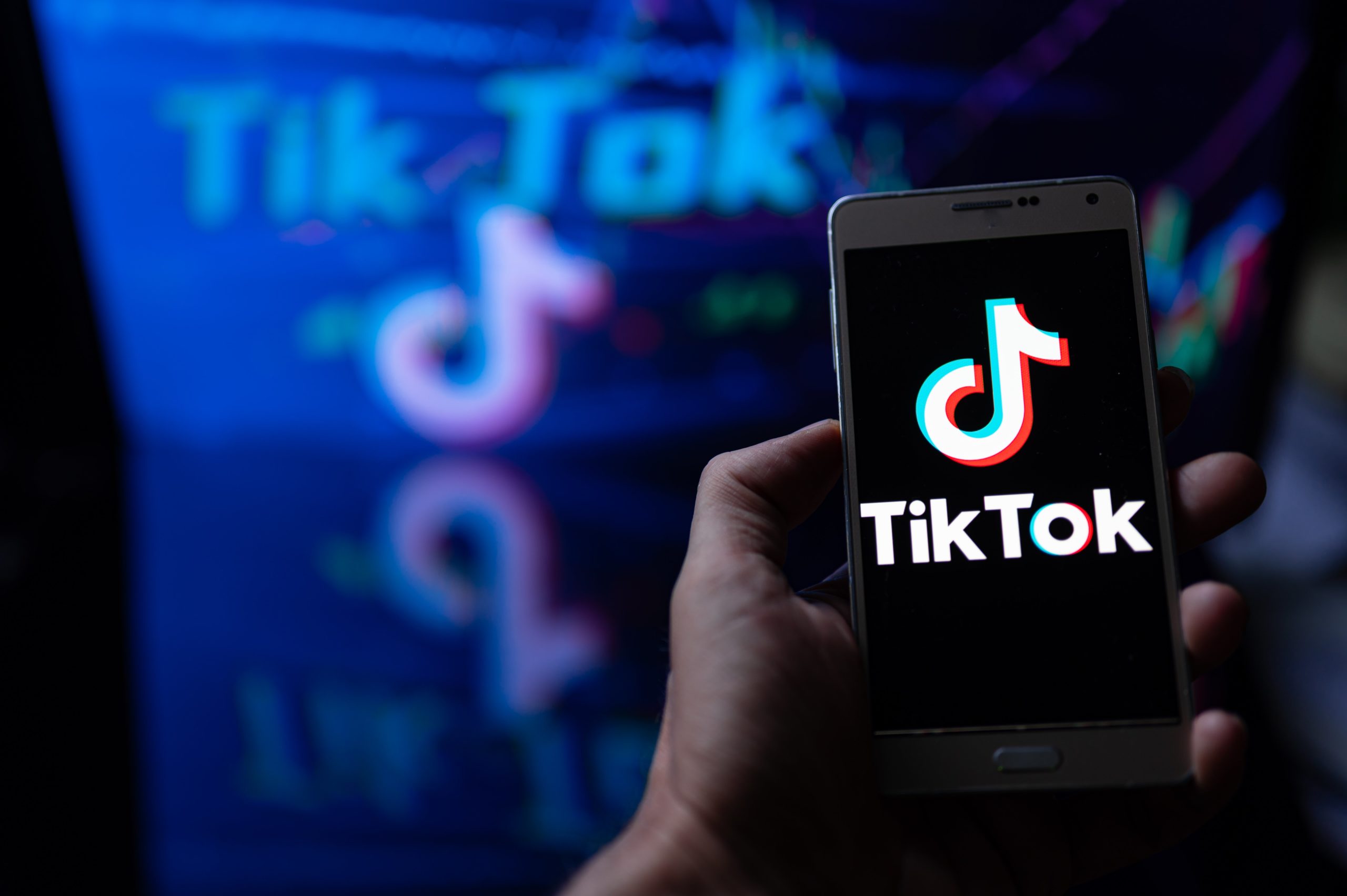 Photo illustration a TikTok logo seen displayed on a smartphone