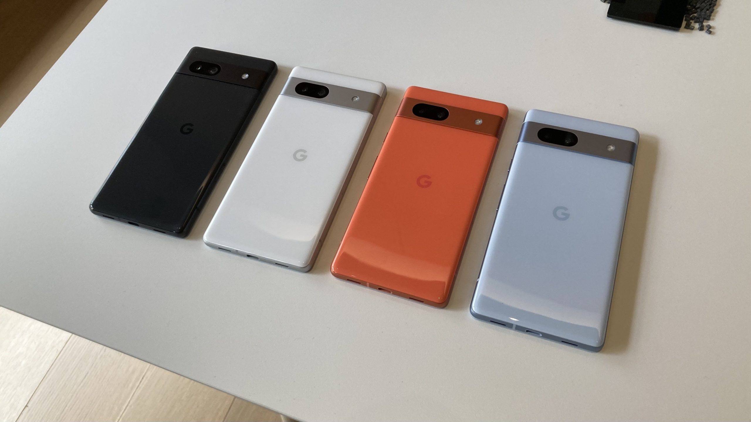 Four Google Pixel 7a phones set side by side