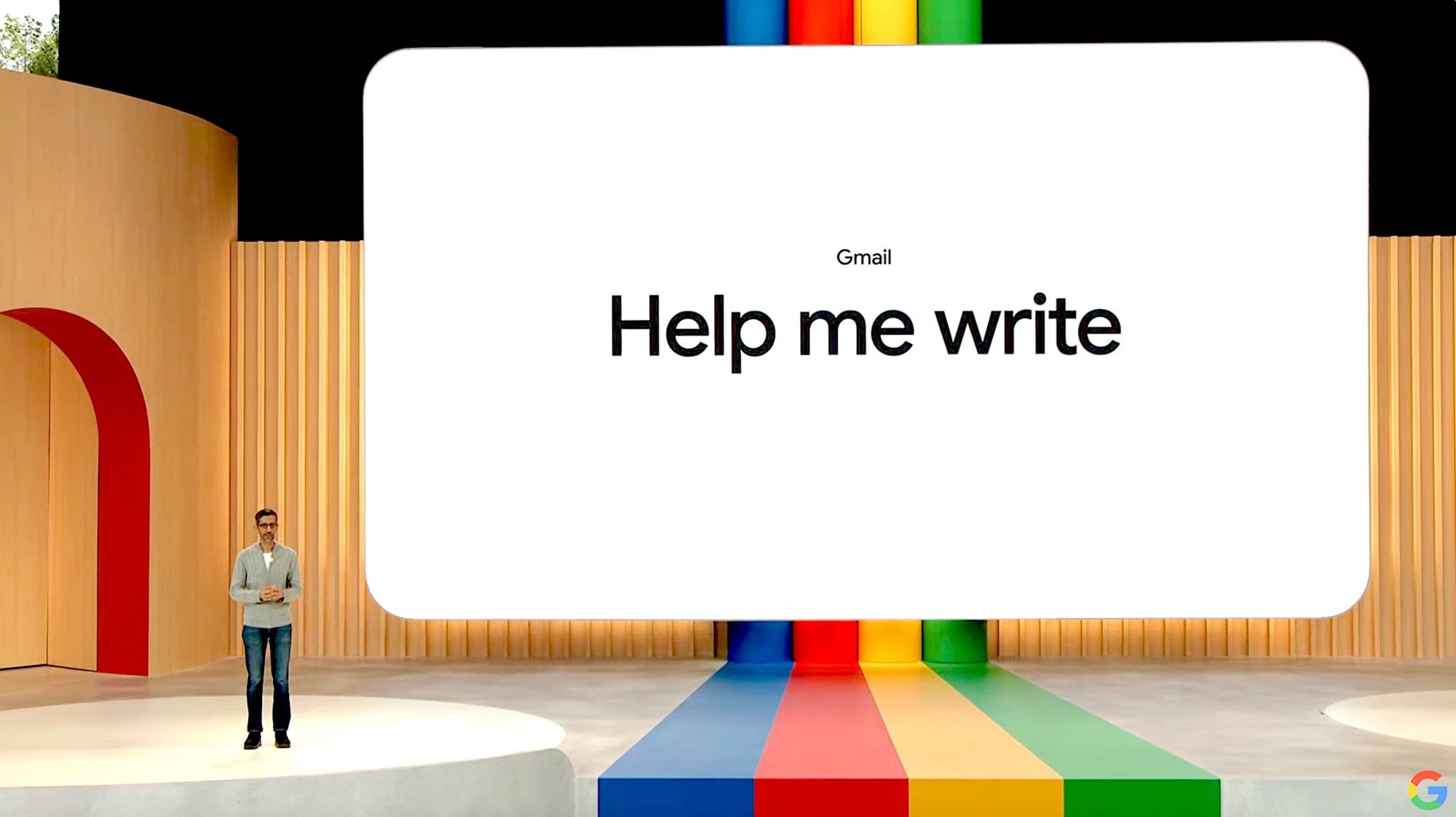 Google CEO Sundar Pichai in front of a slide reading 'help me write' 