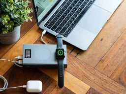 Charger with laptop, smart watch, and airpods plugged in