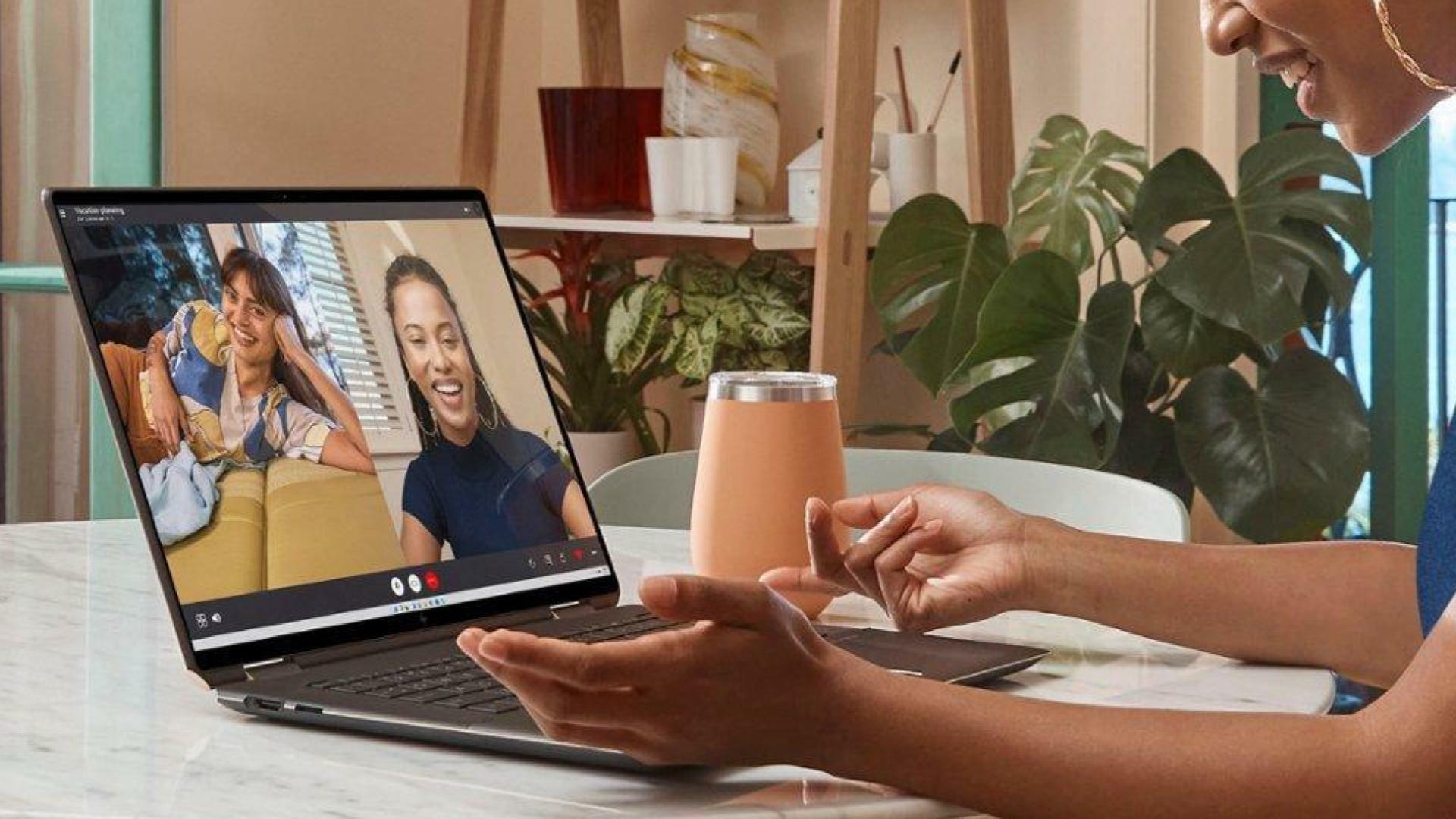 Person on laptop chats video chats a frined