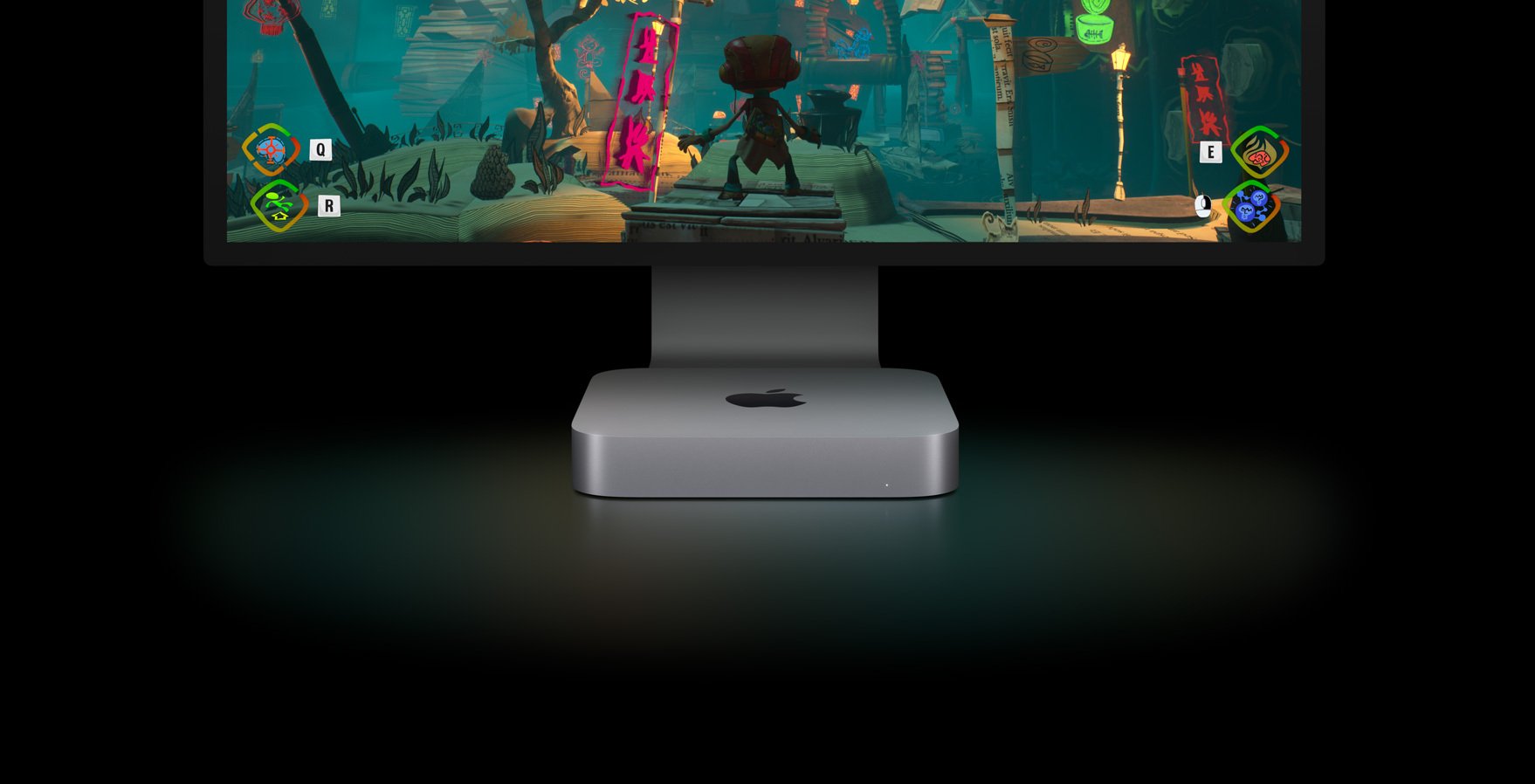 The Apple Mac mini resting below a larger Apple-brand monitor
