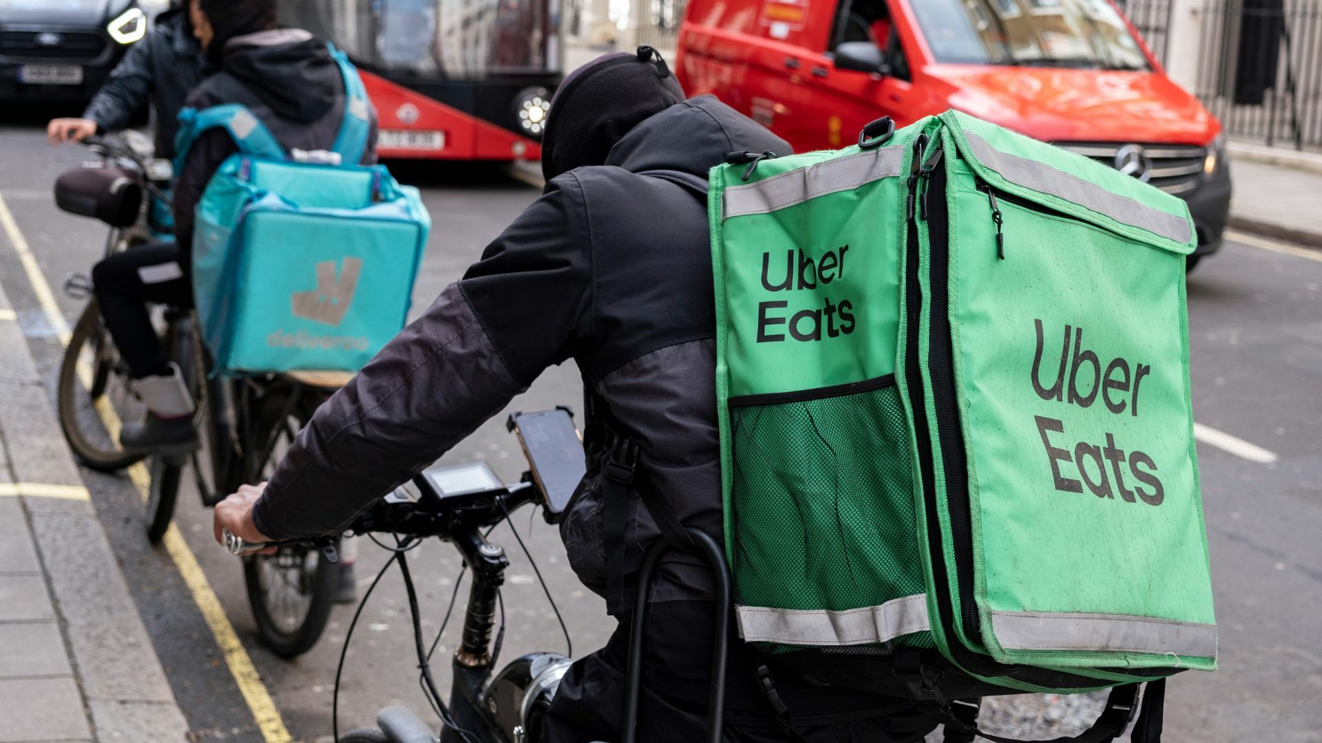 A delivery driver on a bike in London.