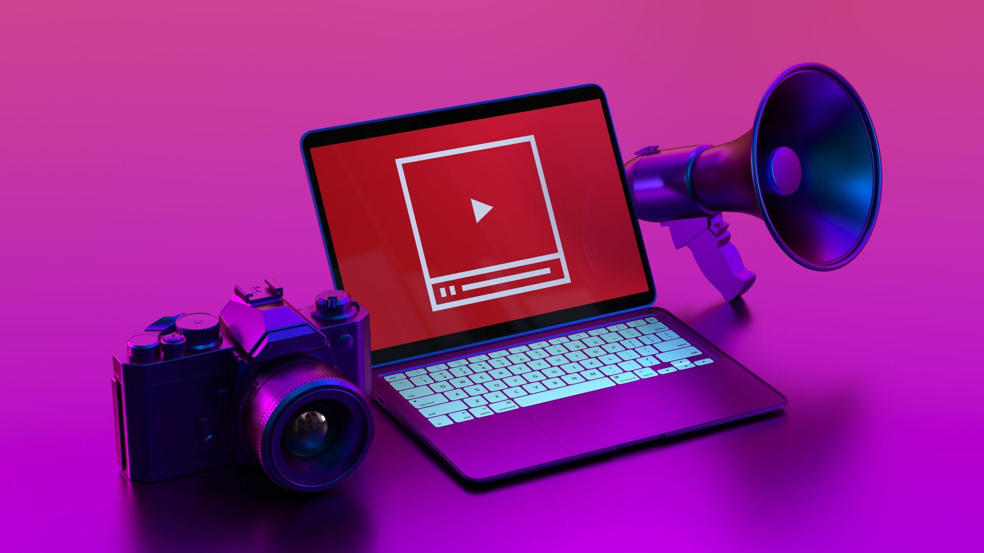 A laptop with a play logo and camera and microphone by its side.