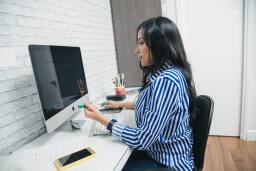 woman using a desktop computer
