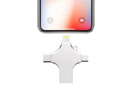 The 4-in-1 Smart Flash Drive near an iPhone on a white background