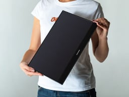 Woman holding a monitor