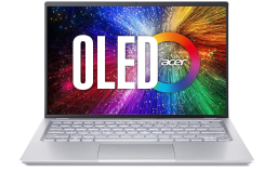 silver notebook with rainbow desktop image and OLED written on the screen