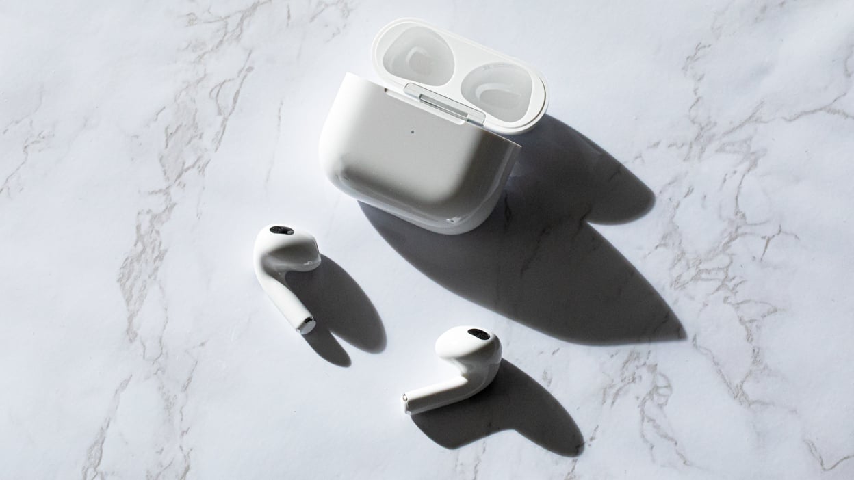 Apple AirPods on marble surface