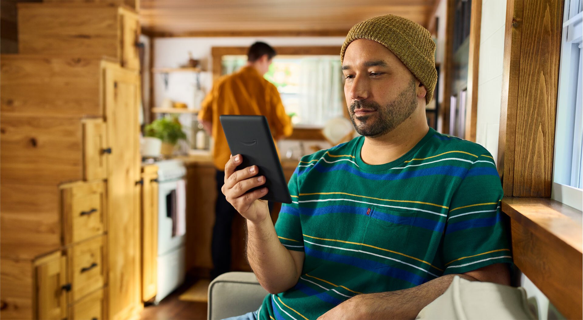 Person reading Kindle Paperwhite Signature Edition