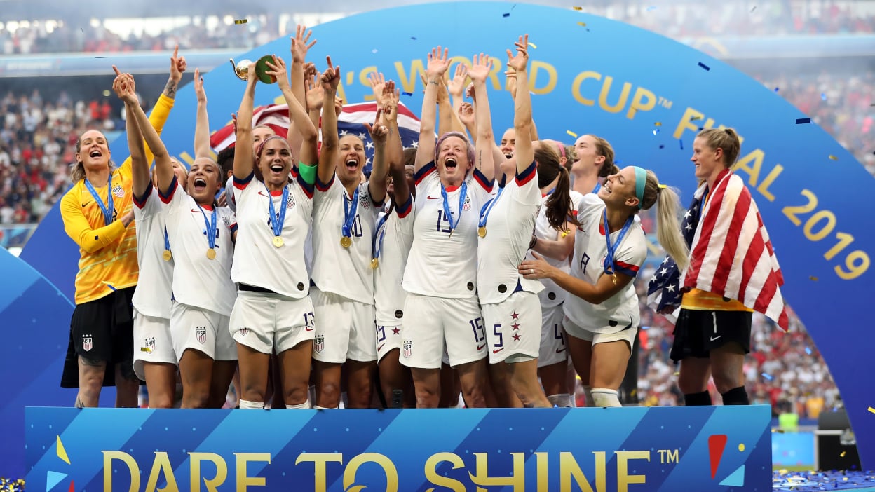 U.S. Women's National Team lifting World Cup trophy