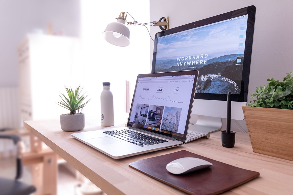 laptop and desktop computer on desk