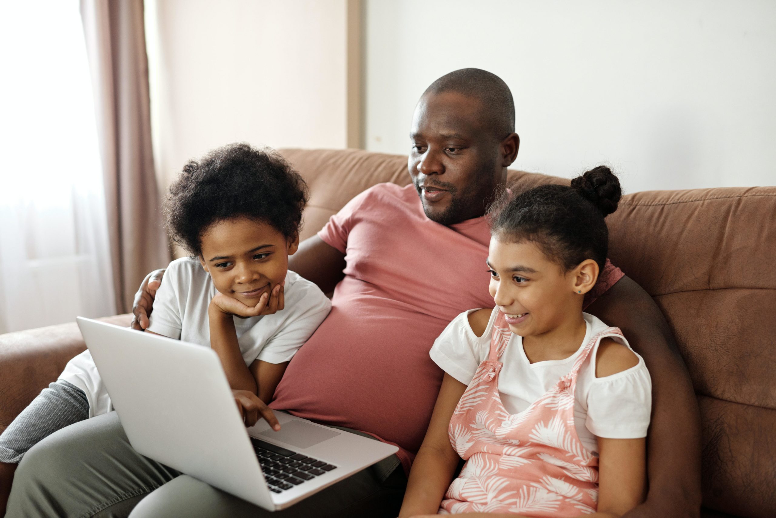 Family watching a laptop