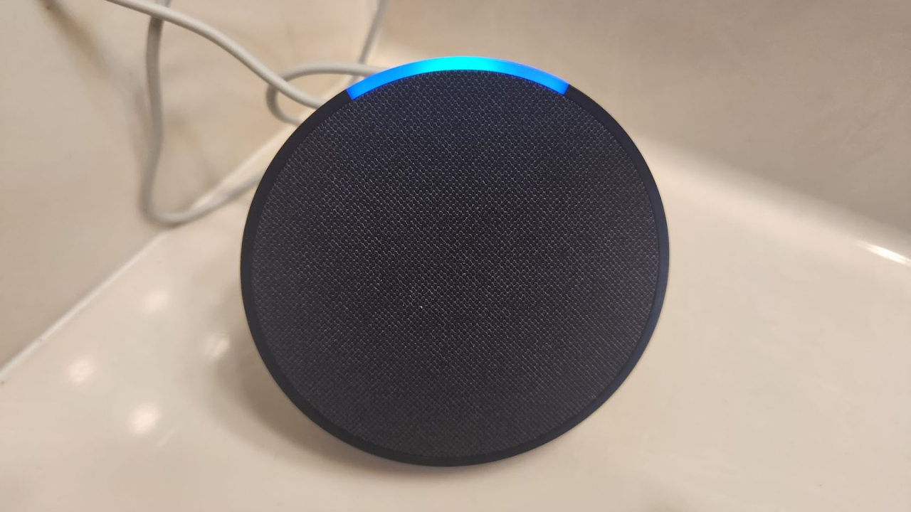 round black echo pop speaker on bathroom counter