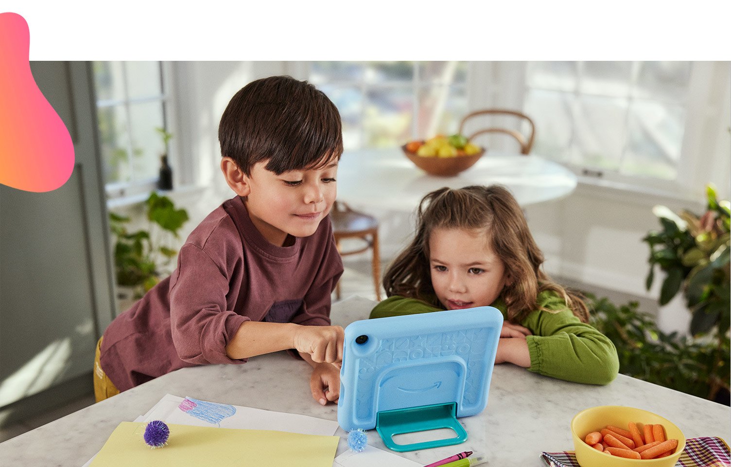 Two kids using Amazon Fire 7 Kids