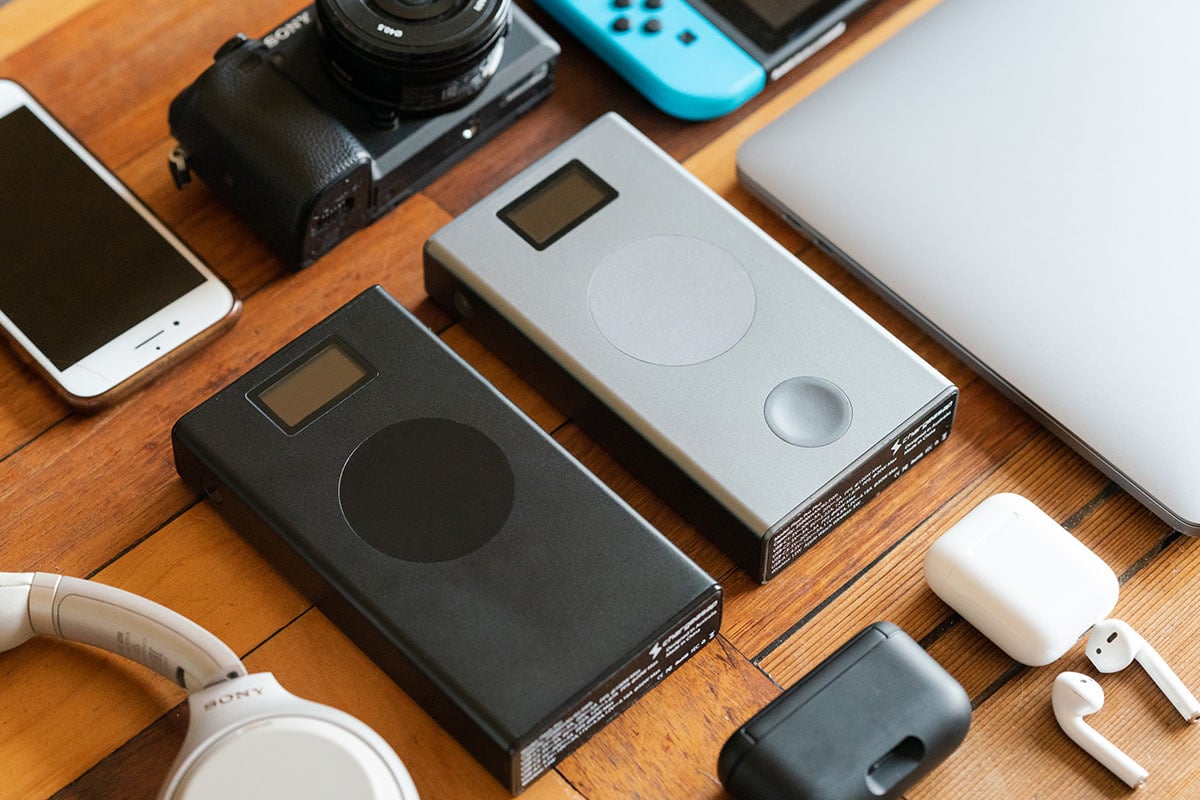 Two portable chargers among some devices