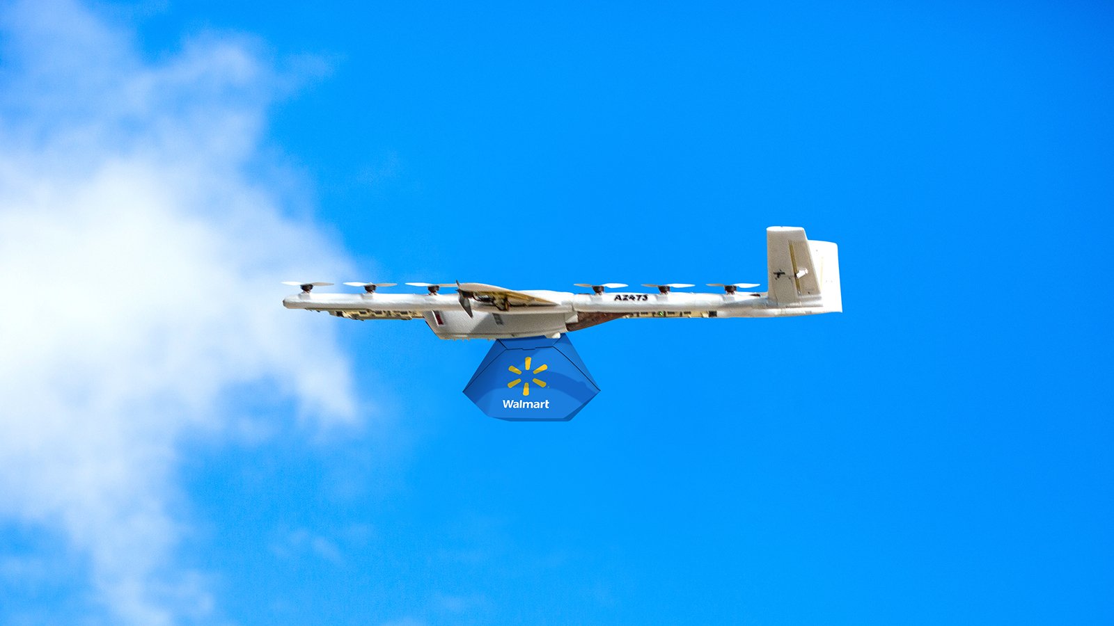 a rendering of a wing drone carrying a package