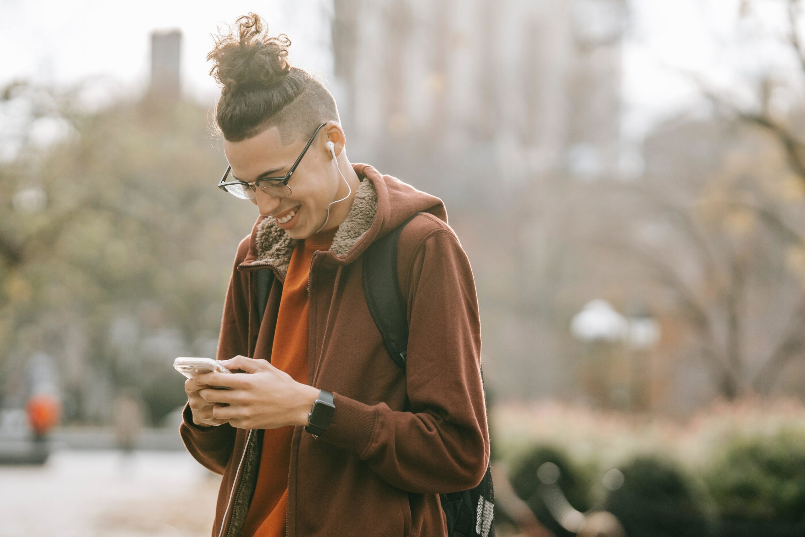 Man smiling at phone