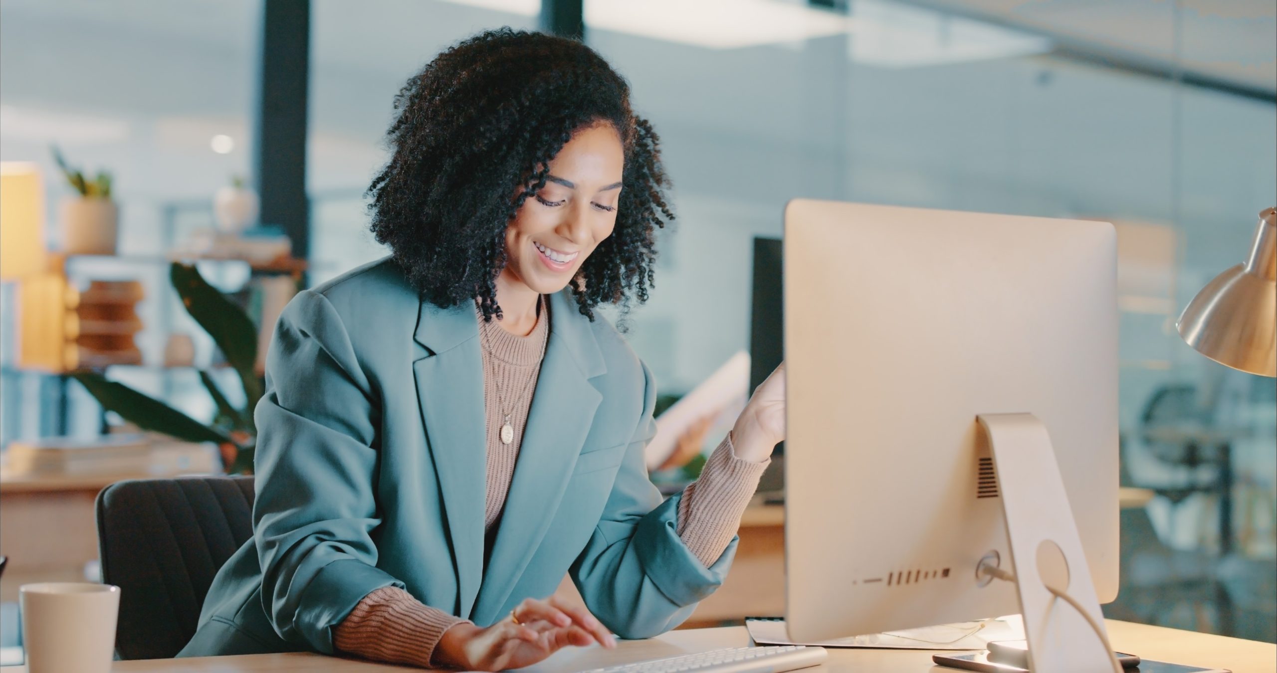 woman using desktop computer