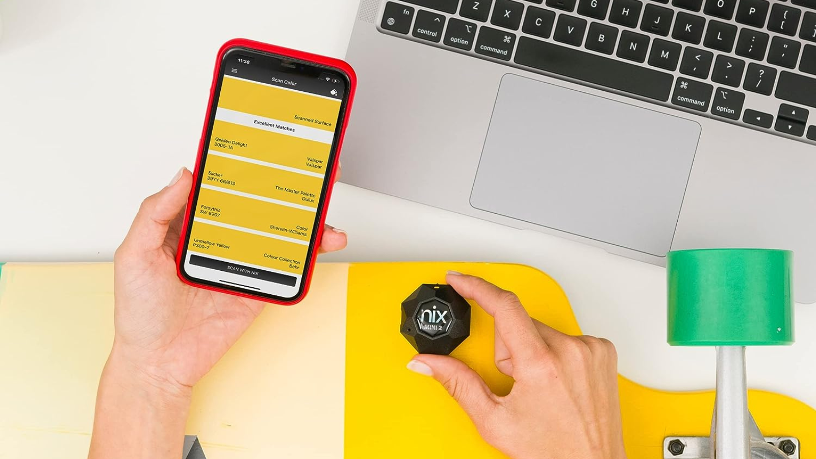 person using Nix sensor to scan color
