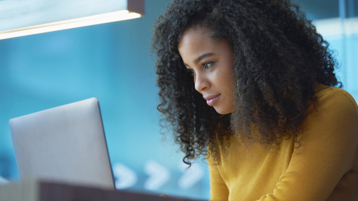 Girl looking at laptop