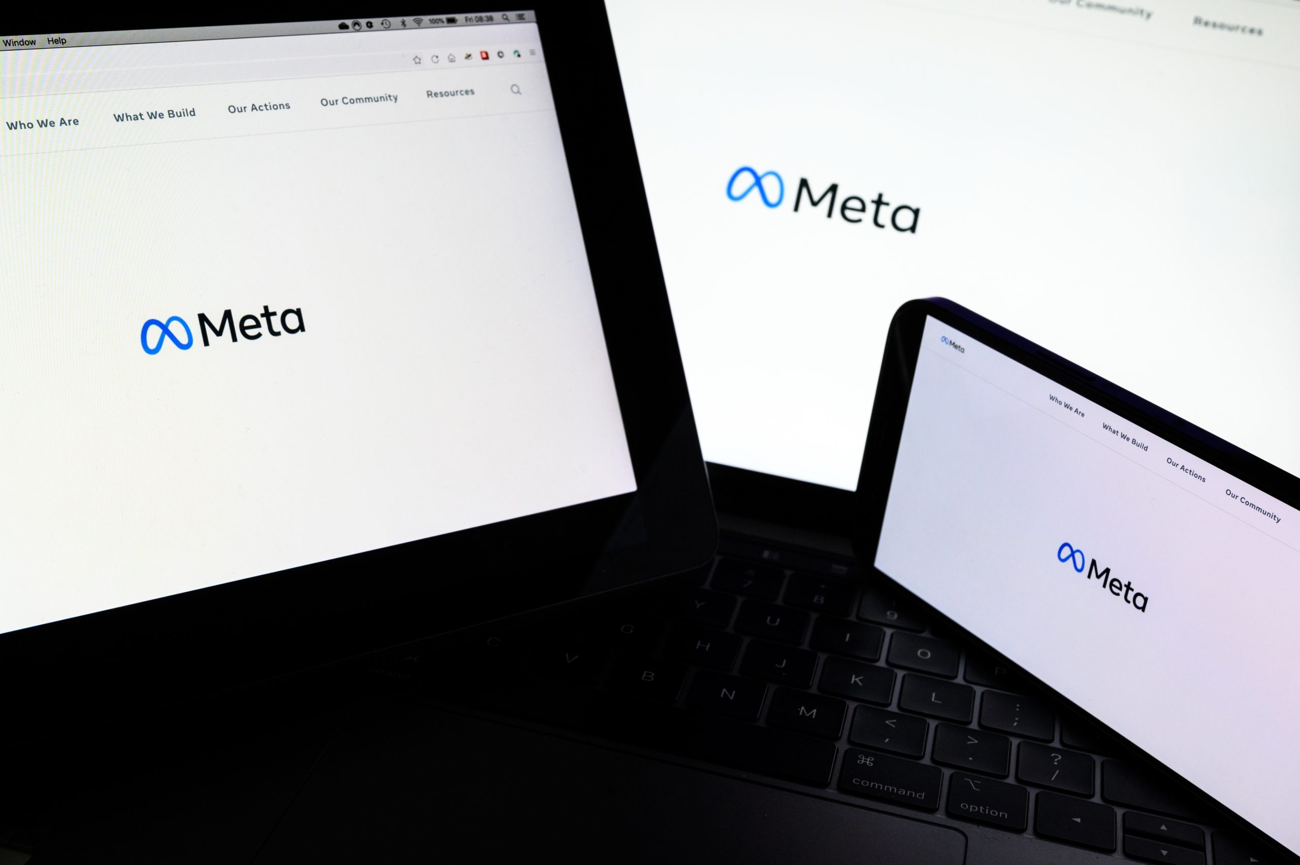 In this photo illustration, three screens display the splash page for the Meta page on the facebook website on October 29, 2021 in London, England