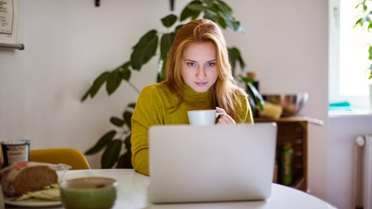 Woman staring at laptop