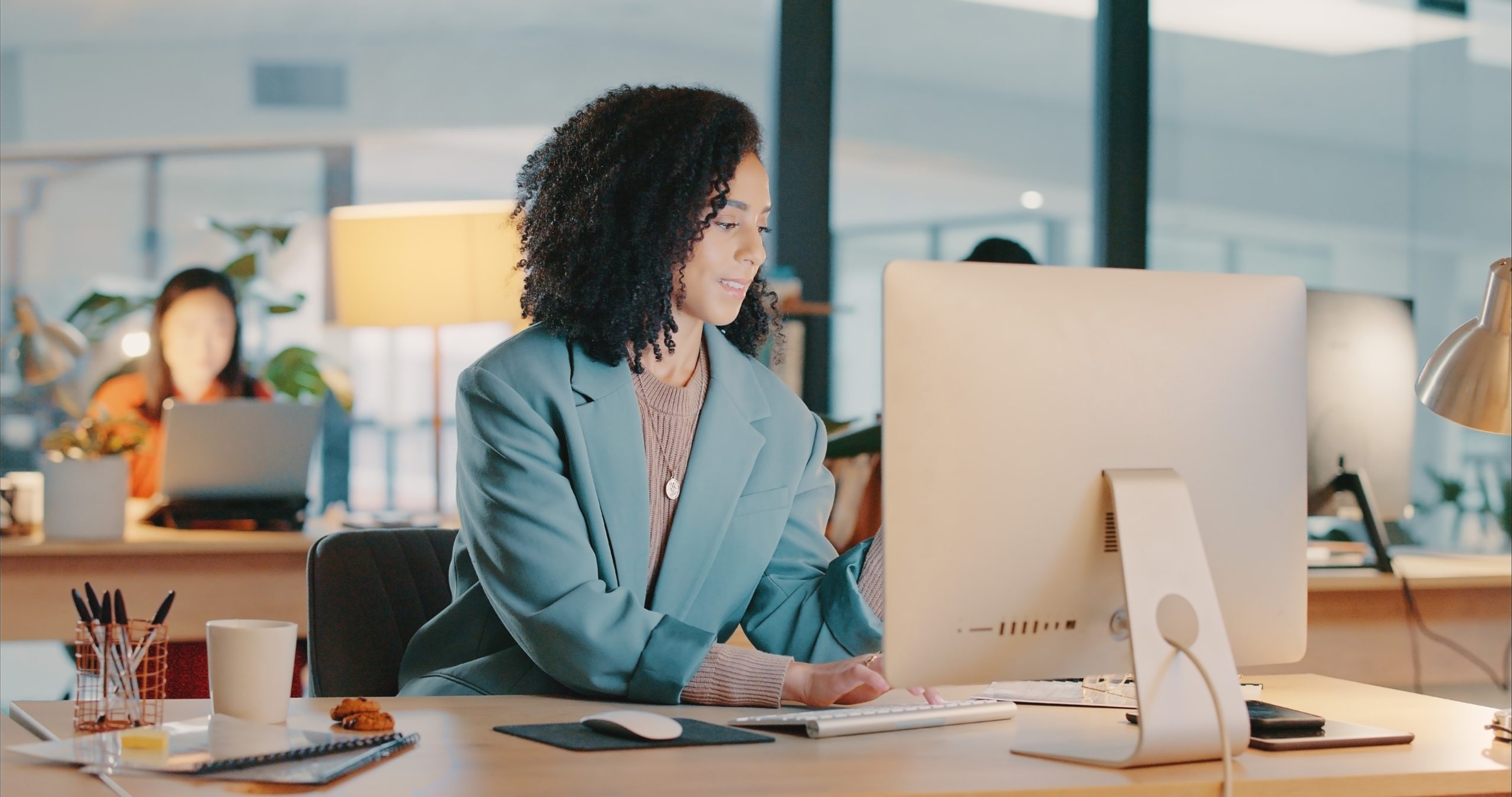 woman using desktop in an office