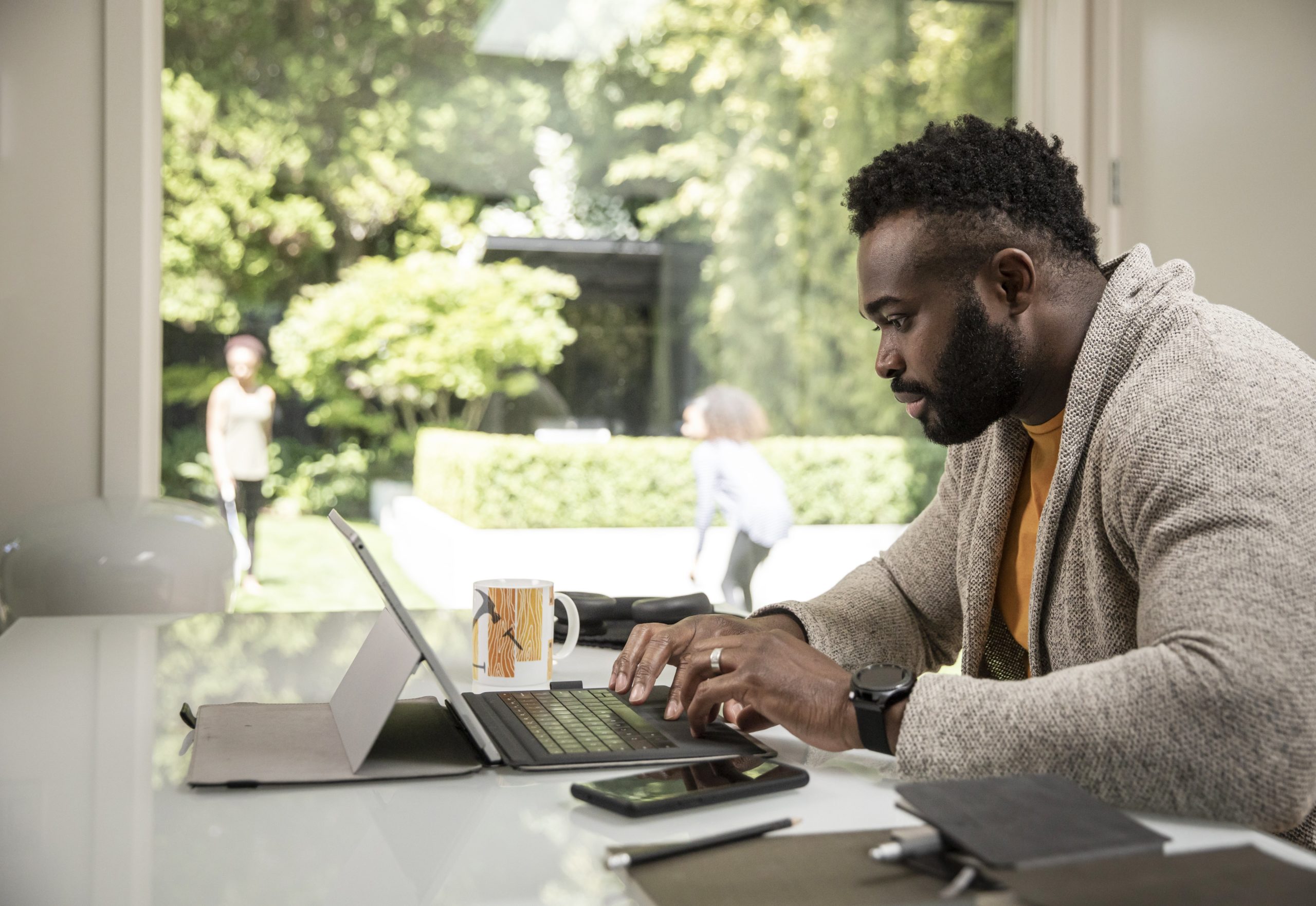 man using tablet with keyboard