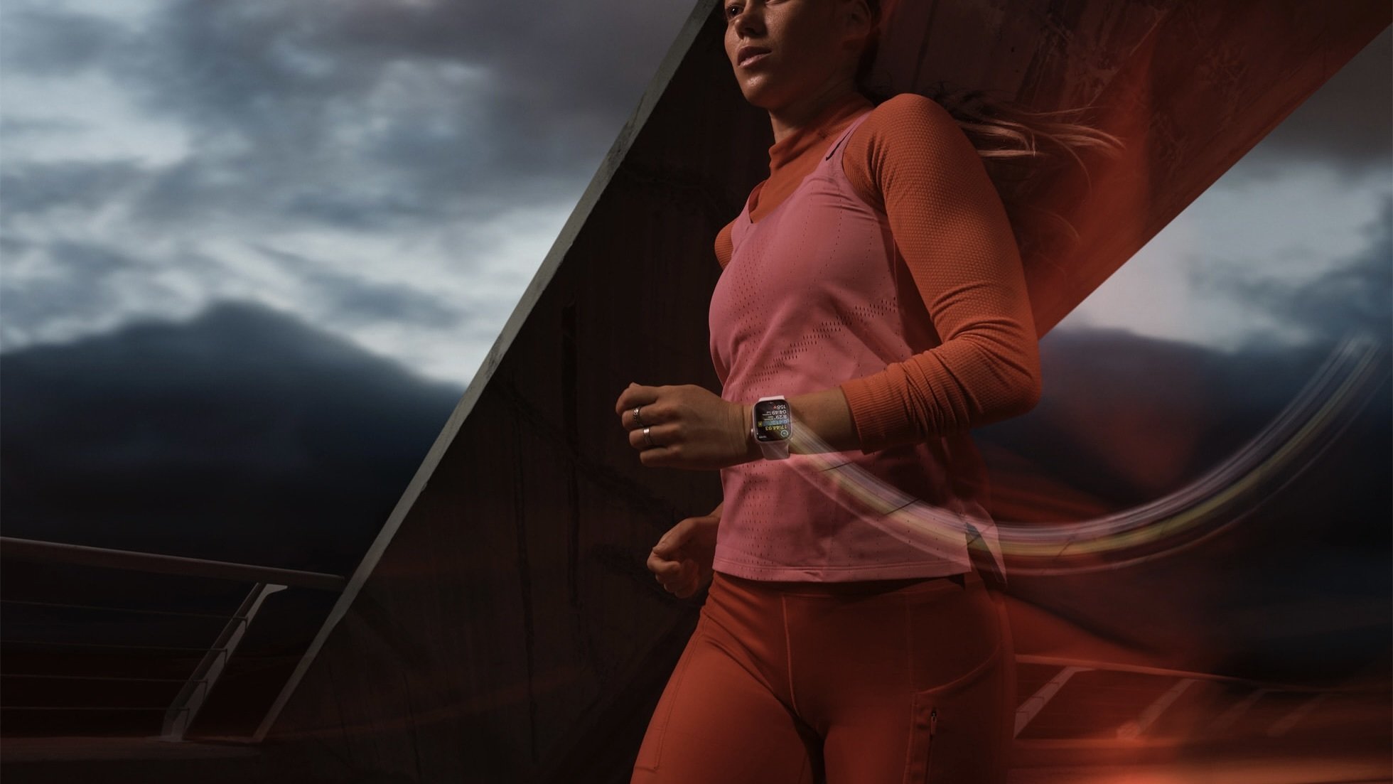 person running while wearing pink apple watch series 9