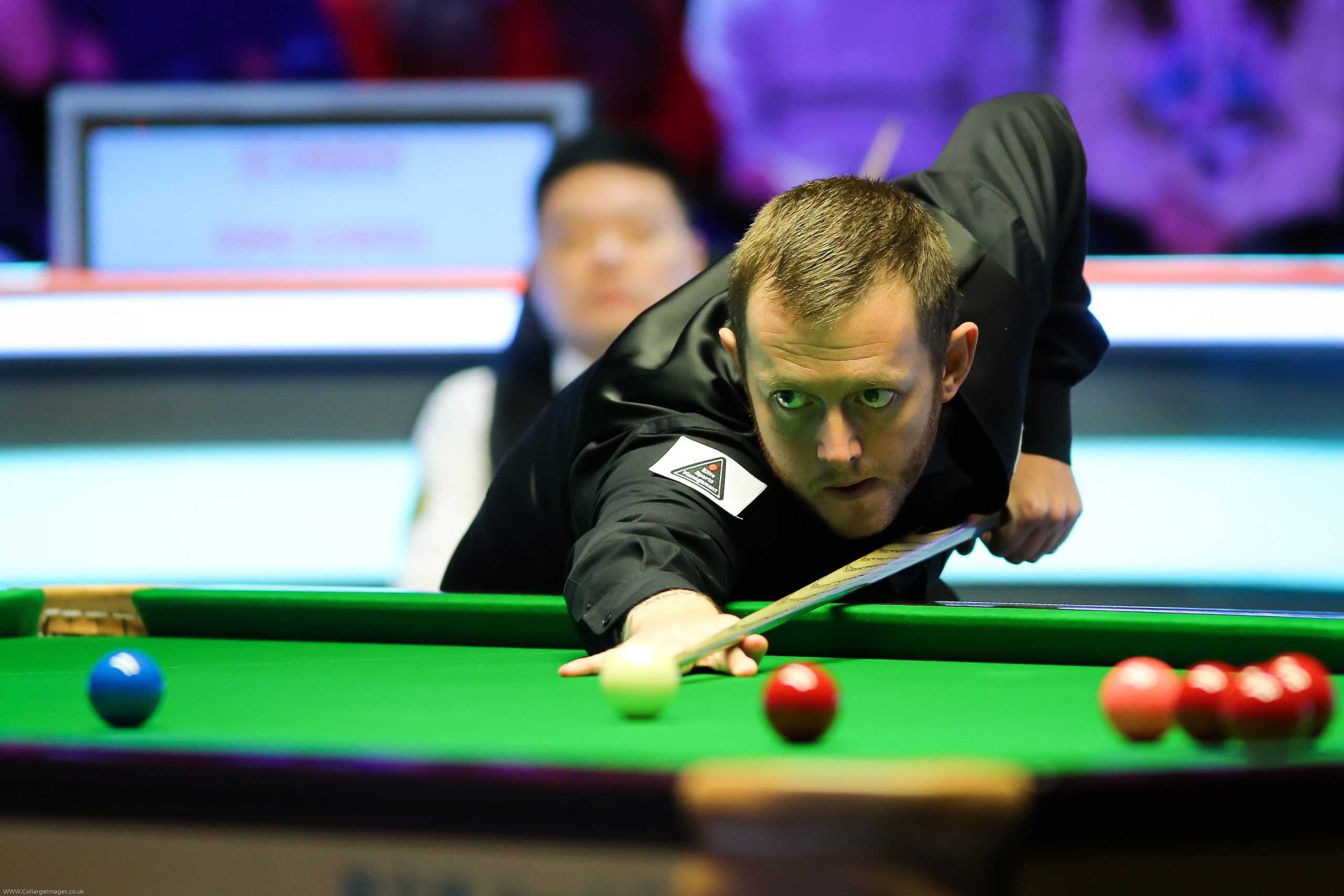 Mark Allen of Northern Ireland plays a shot