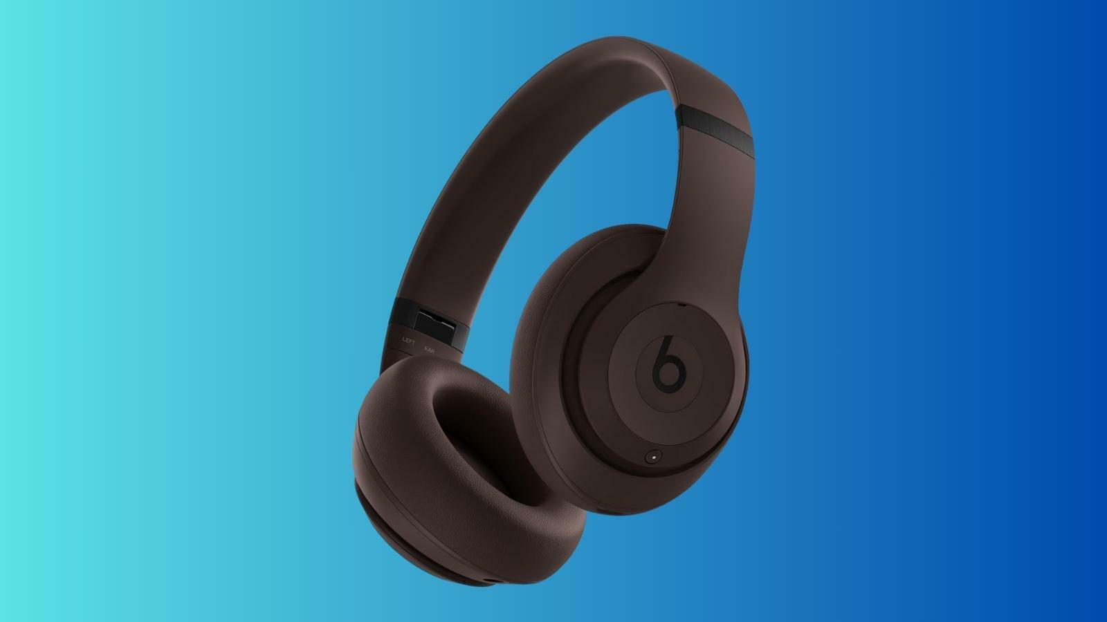 Beats Studio Pro headphones on blue background