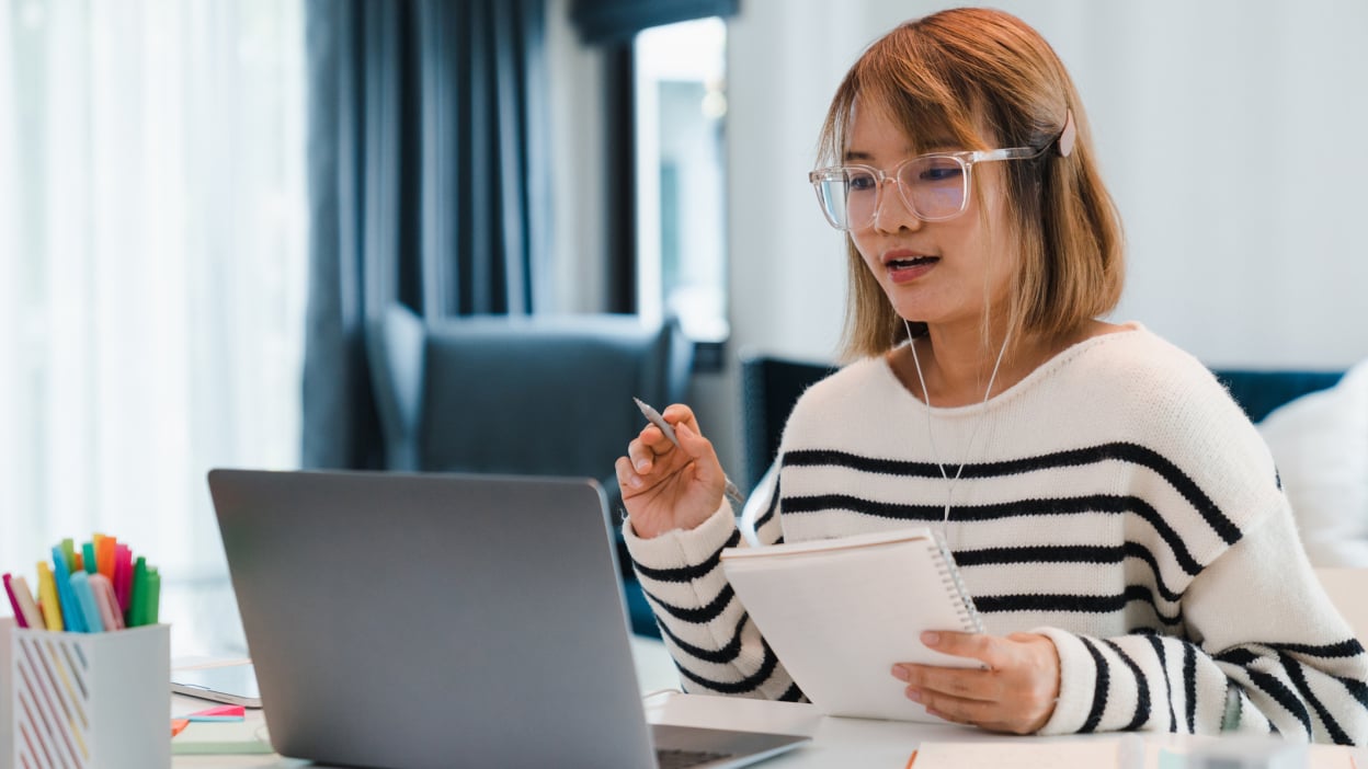 Person talking to laptop